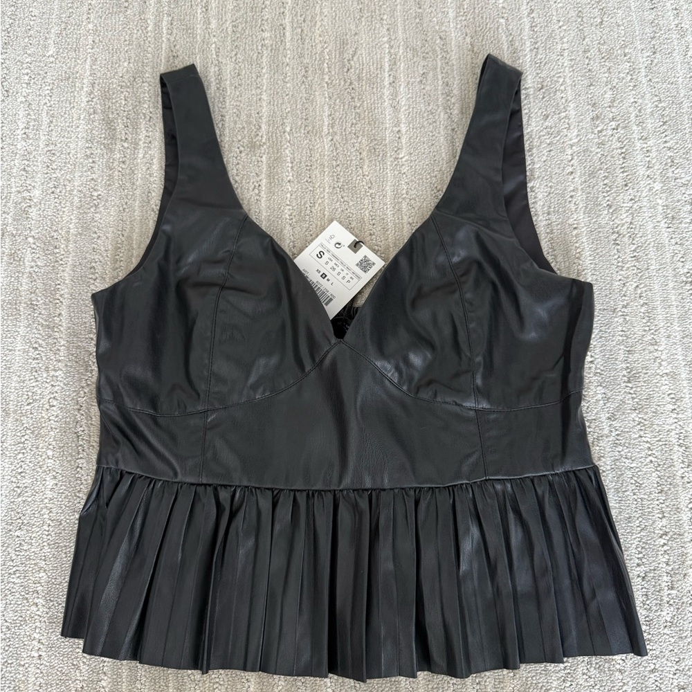 Peplum faux leather top
